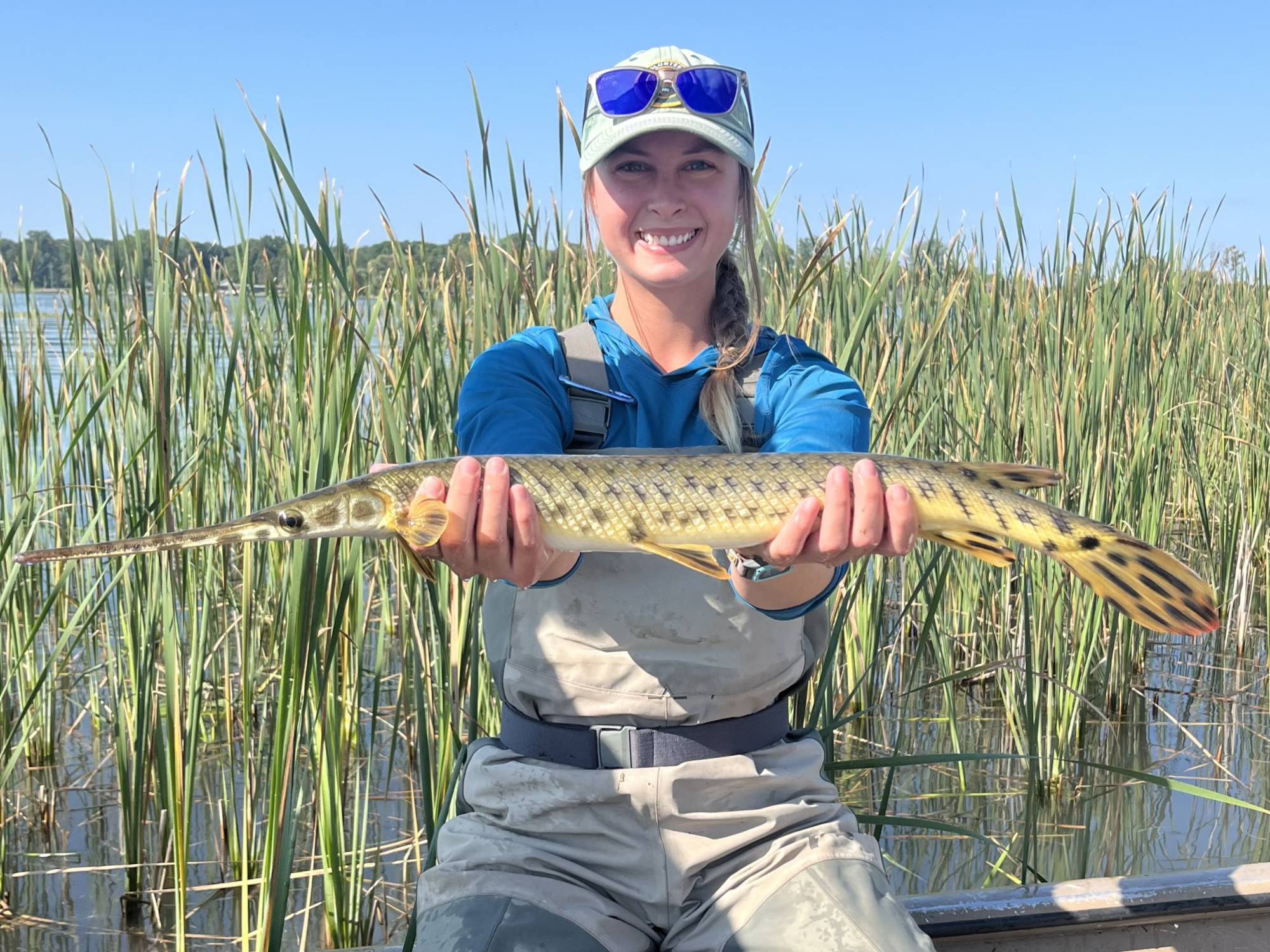 Emily Eberly holds a gar for the camera.